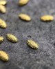 Полусферы лепестки шлифованные золото 2х3 мм Полусферы лепестки шлифованные золото 2х3 мм
